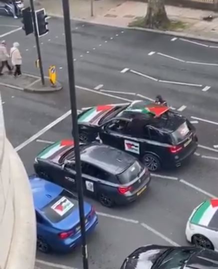 A loudspeaker can be seen in the window of the grey BMW waiting at the traffic lights in Finchley Road. Credit: Twitter